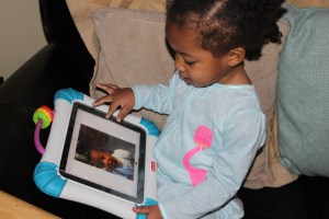 Quinn looking at photos of herself