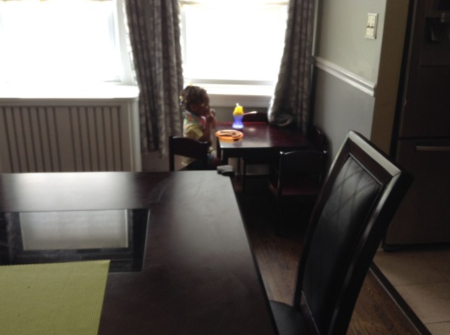 Quinn Sitting Across from the Dining Room Table