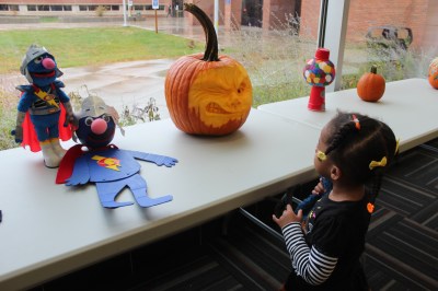 Quinn at the Pumpkin Contest with Super Grover